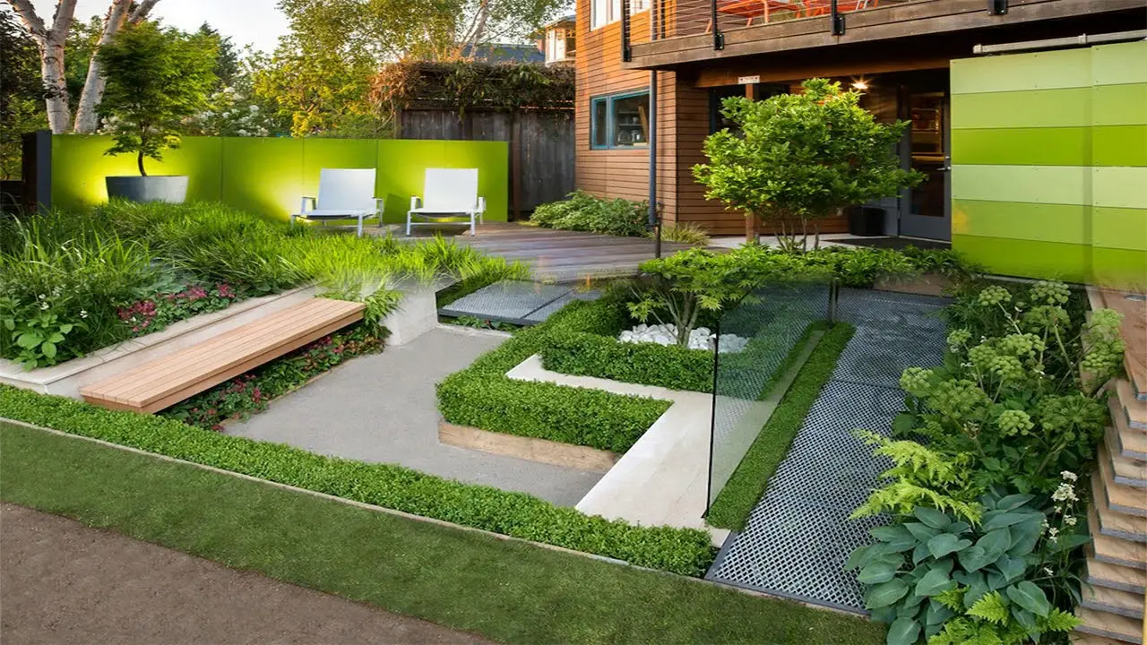Well-maintained villa garden with a tidy lawn, hedges and seating
